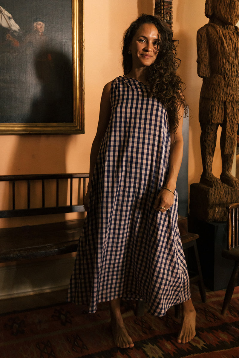 Cotton gingham one-shoulder Anju dress with waist tie, handmade in India.  | navy gingham