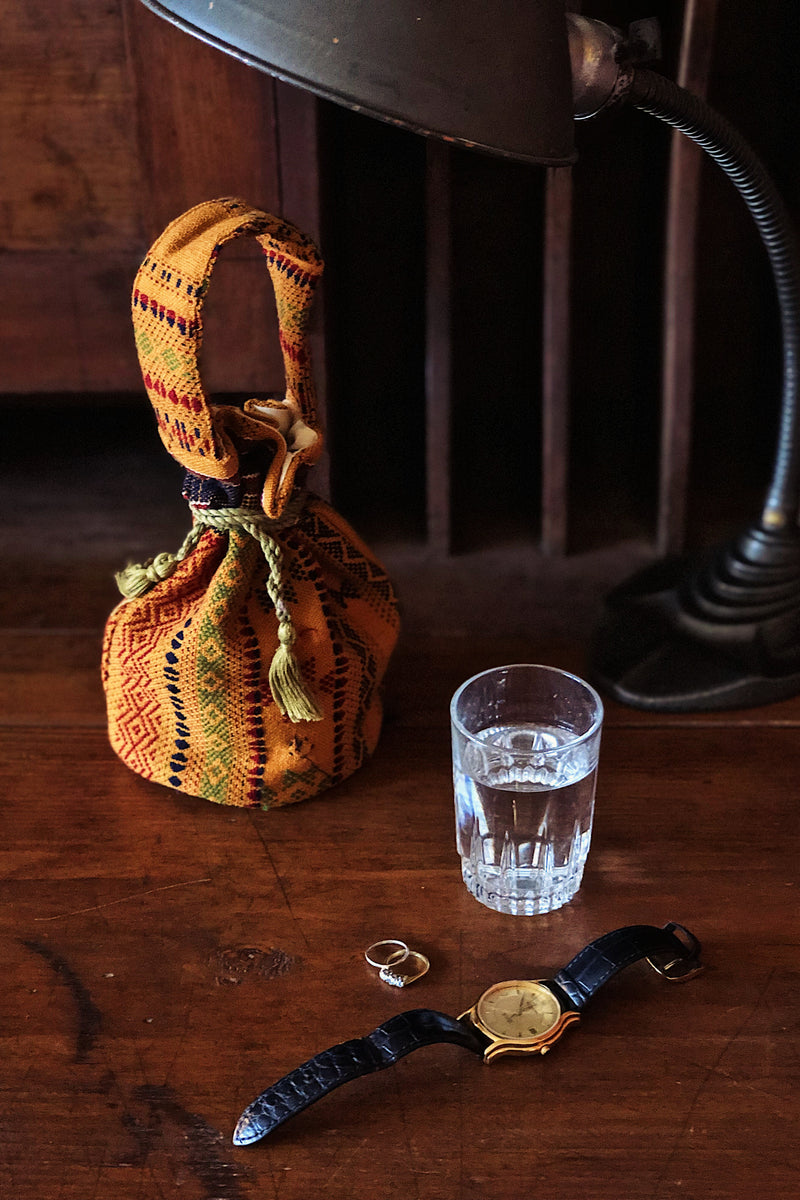 Small upcycled bhujodi wool bag made from handloomed scrap fabric in India. | mustard