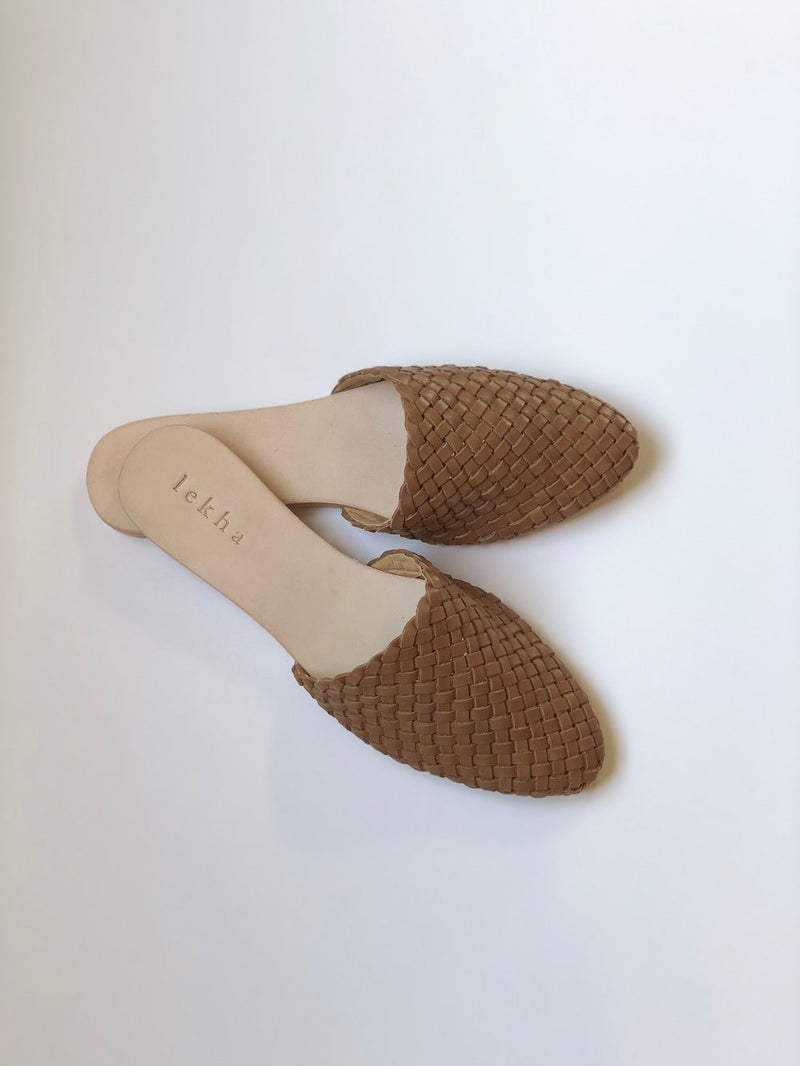 Leather slip-on mule handwoven in India.